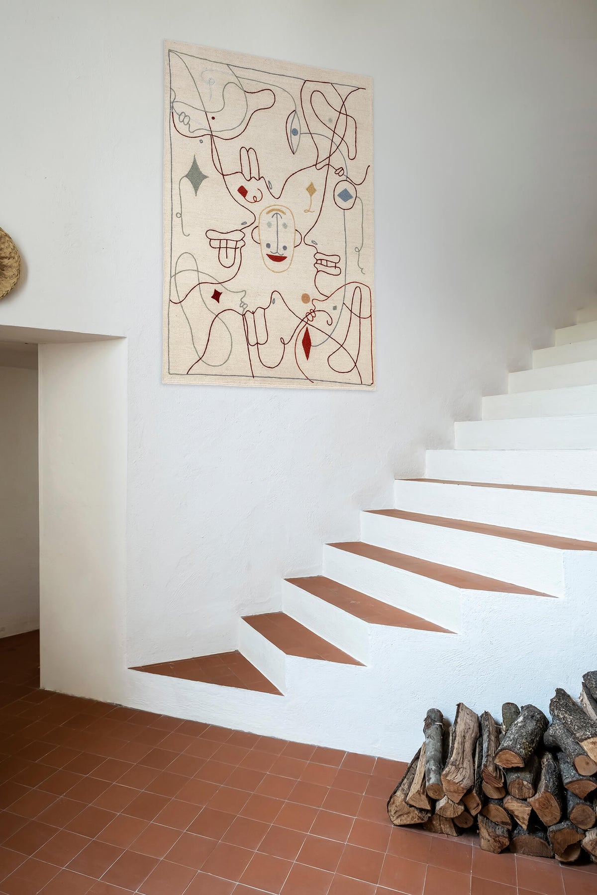 Nani Marquina Silhouette Tapestry by Jaime Hayon hung on a wall