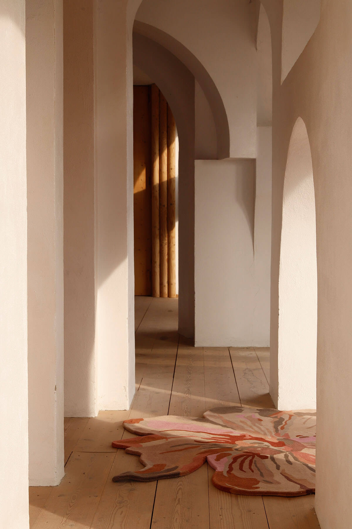 Nani Marquina Flora rugs by Santi Moix in a hallway