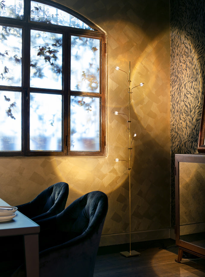 Catellani & Smith Wa Wa Floor Lamp beside a window