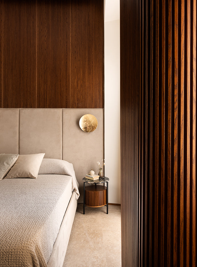 Catellani & Smith Luna Wall Lamp 30 beside a bed
