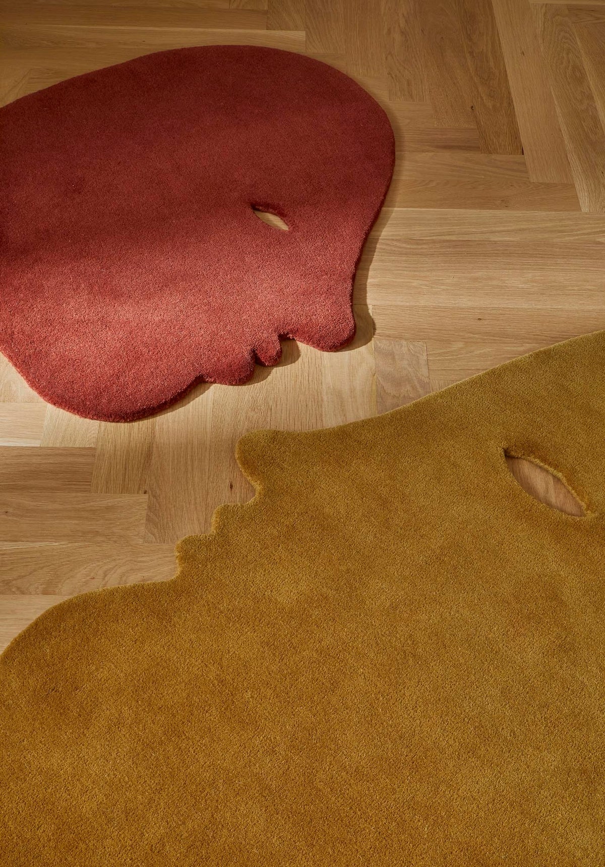 Nani Marquina Talk Talk rugs by Jaime Hayon, brick and mustard