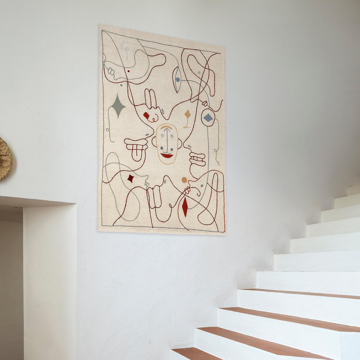 Nani Marquina Silhouette Tapestry by Jaime Hayon hung on a wall